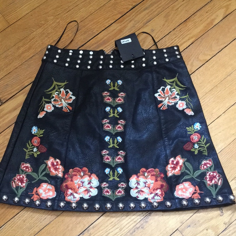 Short embellished leather skirt